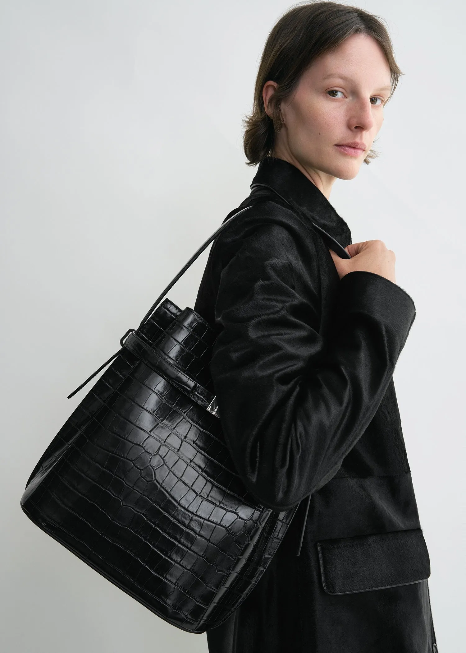 Belted croco-embossed bucket bag black